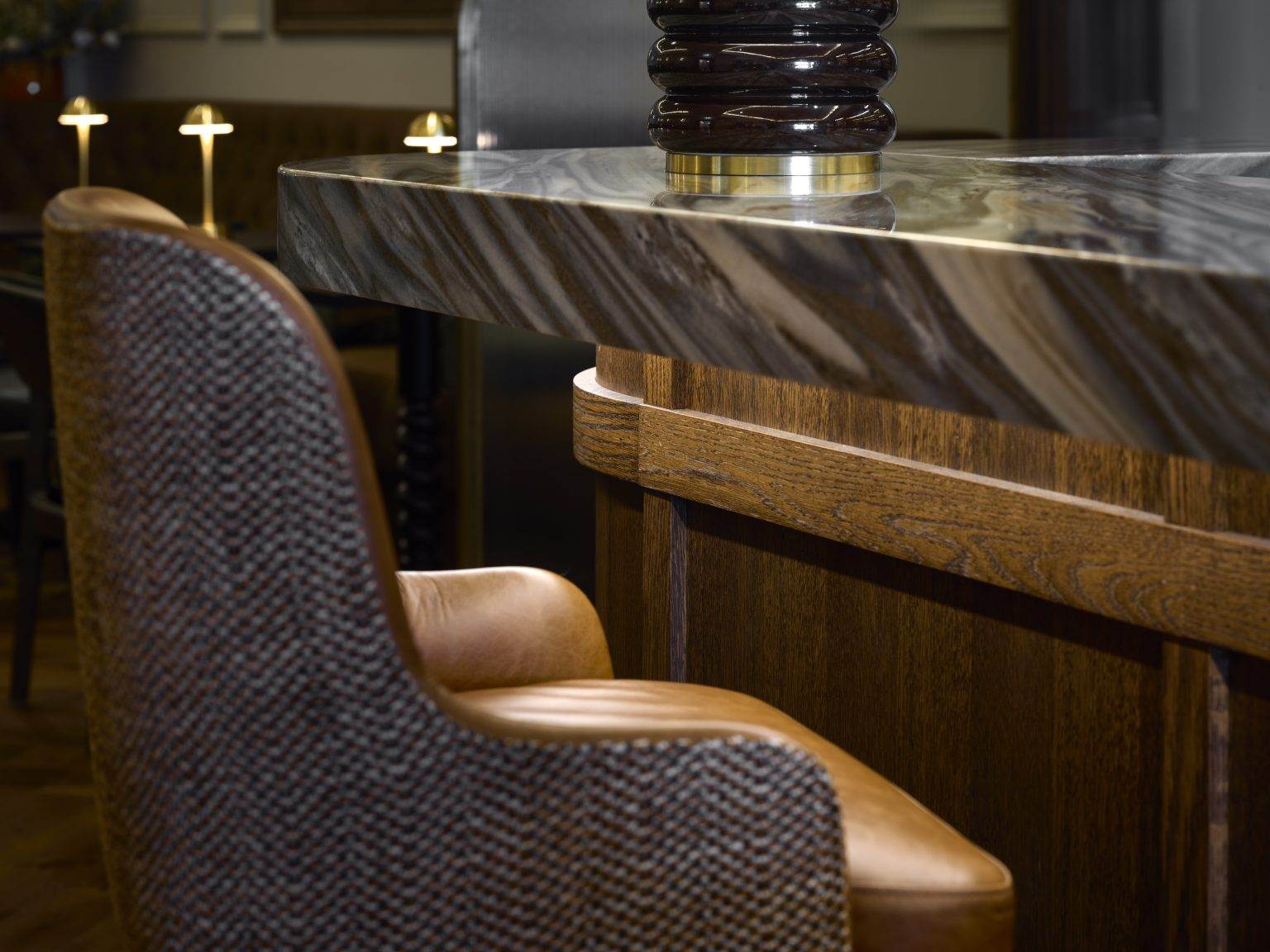 Stylish modern bar fitout with sleek countertop, ambient lighting, and contemporary stools for upscale hospitality spaces