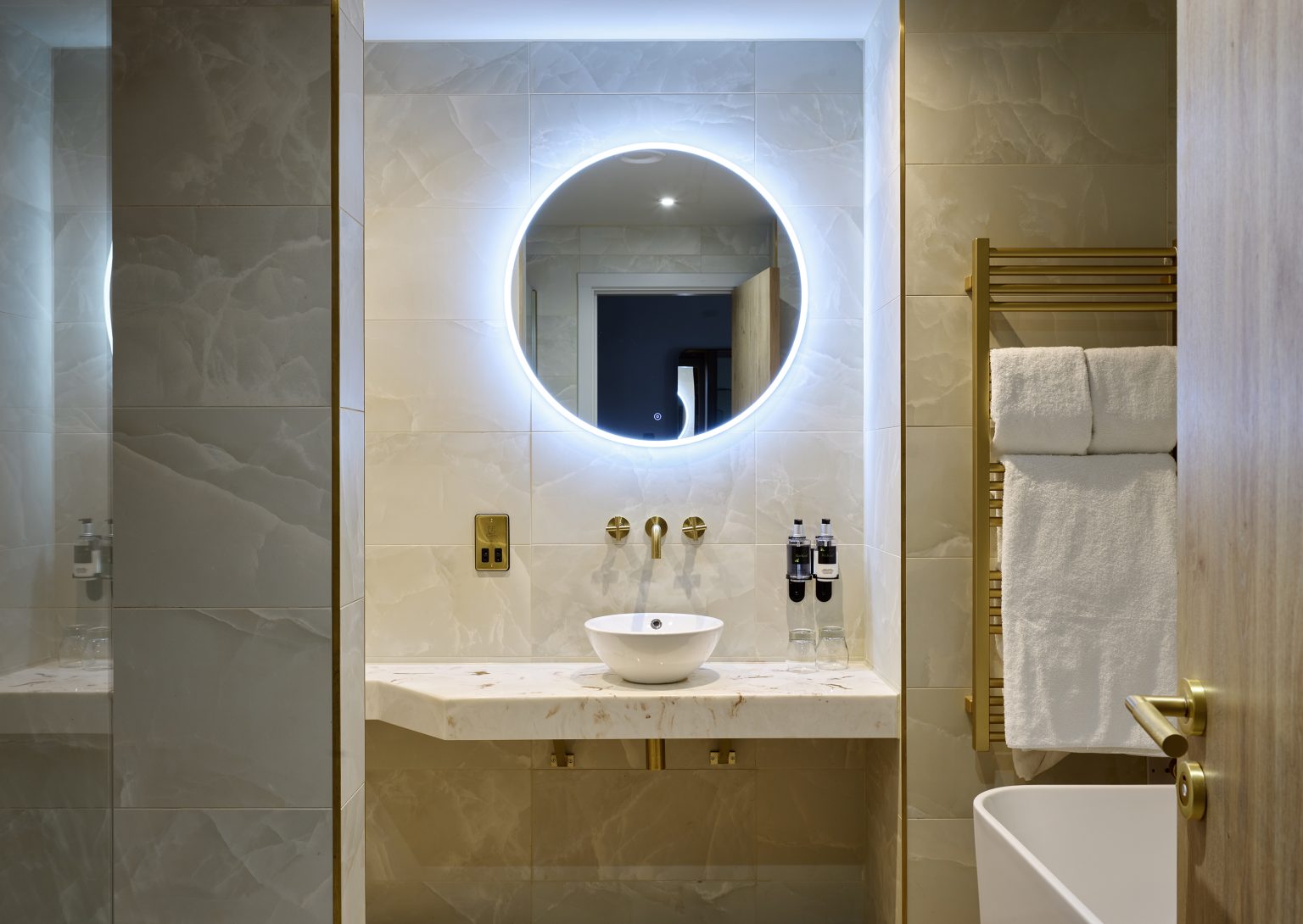 Close-up of brass bathroom tap in a luxury hotel fit-out, highlighting premium design and quality craftsmanship