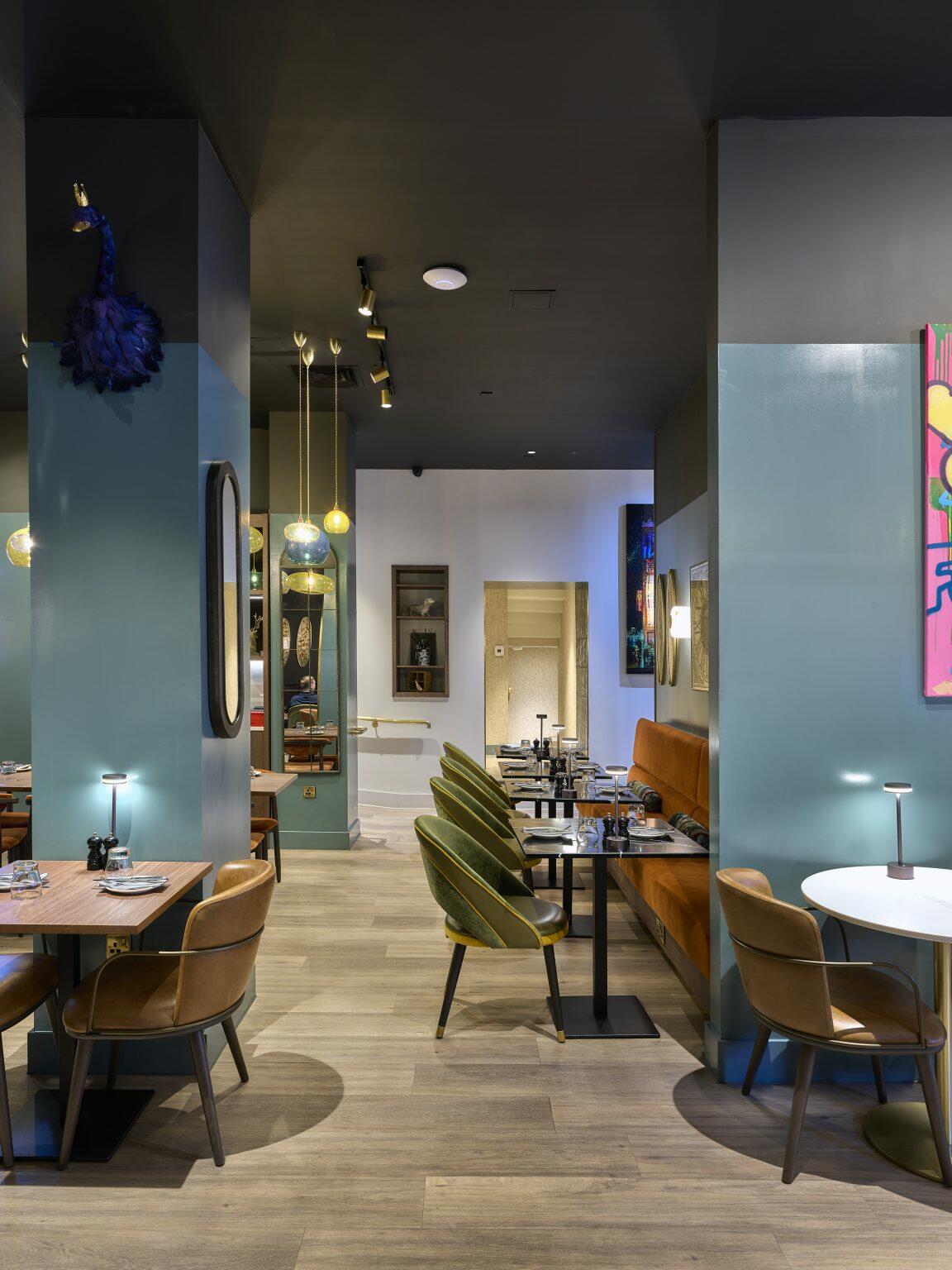 Luxury hospitality fit-out featuring a stylish dining area with plush chairs, ambient lighting, and refined decor elements for a sophisticated guest experience.